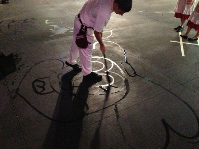 Janitor, artist, or entertainer? Which is his gift? It's often disguised in our day to day motions. Disney janitor painting character on sidewalk with water and broom