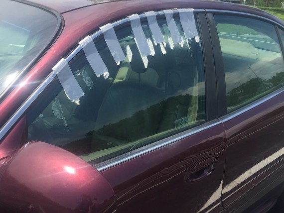 Duct tape holding car window in place
