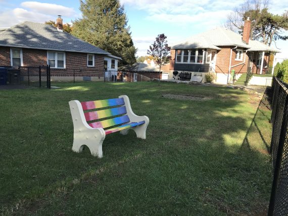 rainbow bench in backyard