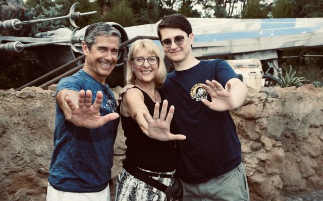 family of 3 at Disney park