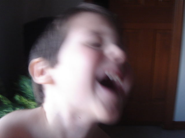child laughing, blurry photo