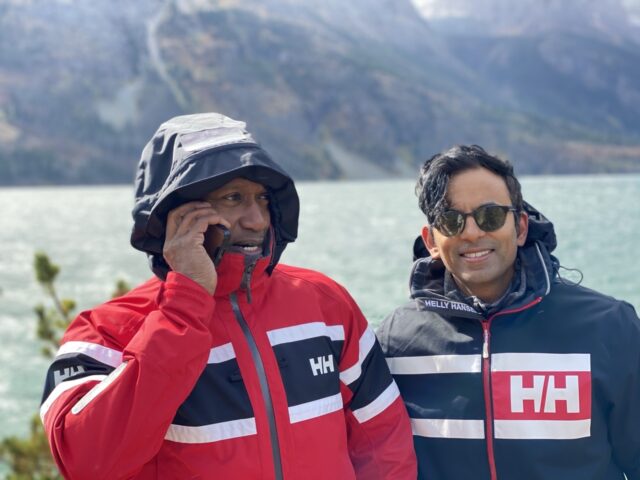 two guys by a lake