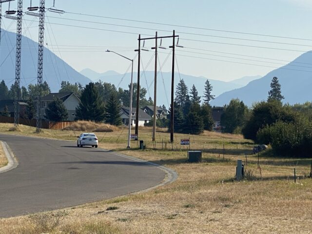 lone car parked on rural road