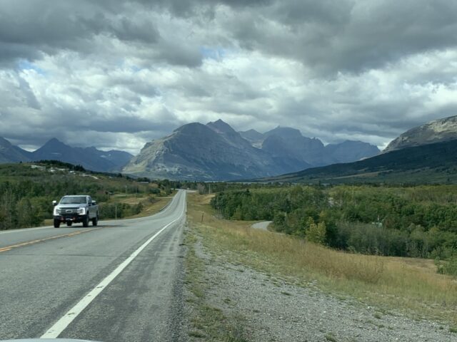 Highway leading to a mountain range