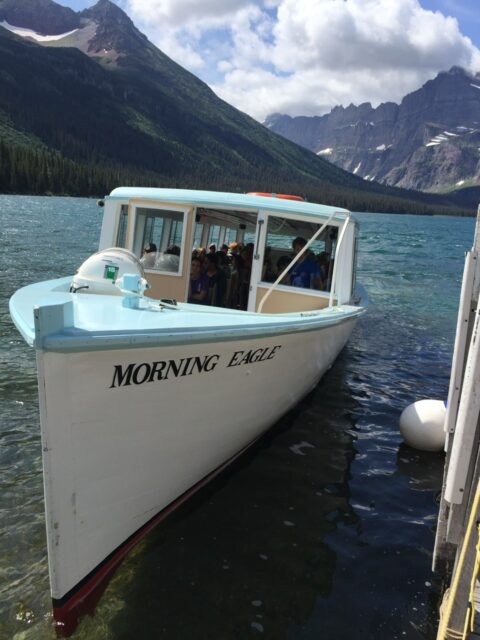 historic boat in mountain lake