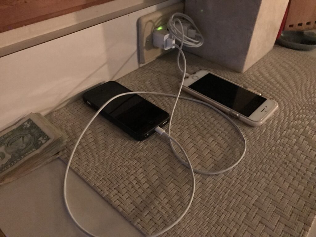 two iPhones charging