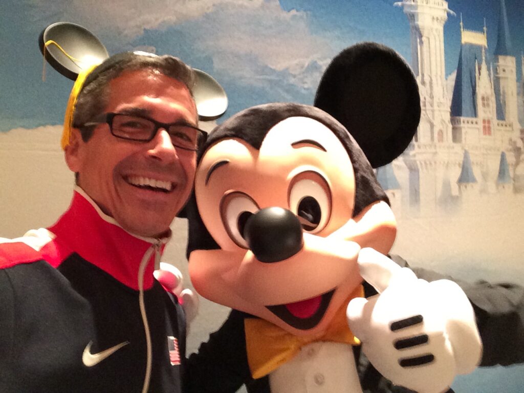 Disney Keynote speaker Jeff Noel with Mickey Mouse