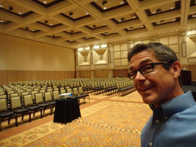 Disney Keynote Speaker Jeff Noel in front of empty conference room