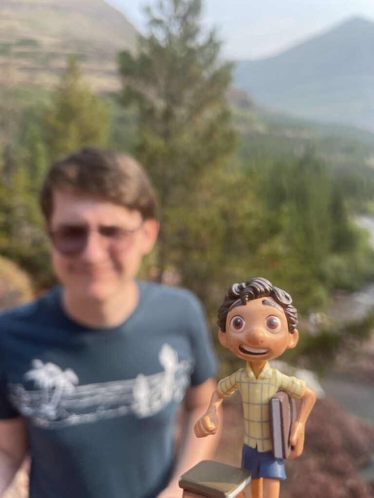 Disney Pixar Luca toy and college student on a mountain trail
