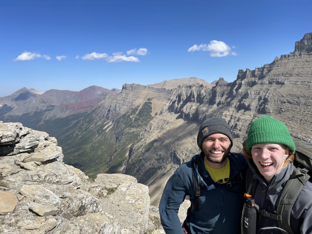 Two hikers posing in the mountains