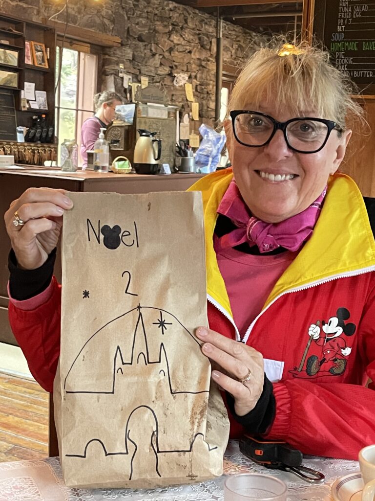 Woman posing with decorated brown bag lunch