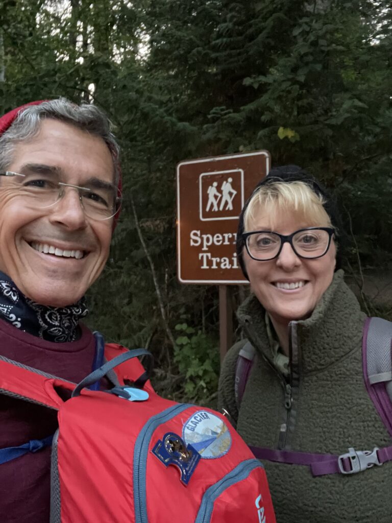 Couple at trailhead sign