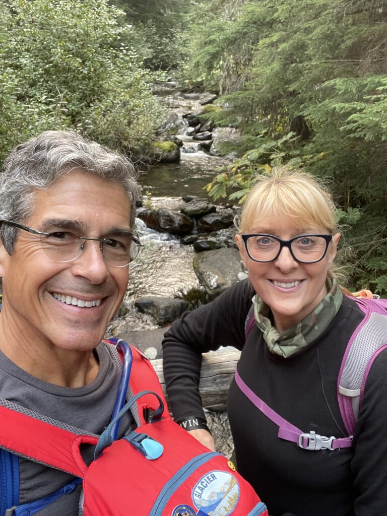 Couple on trail bridge in woods