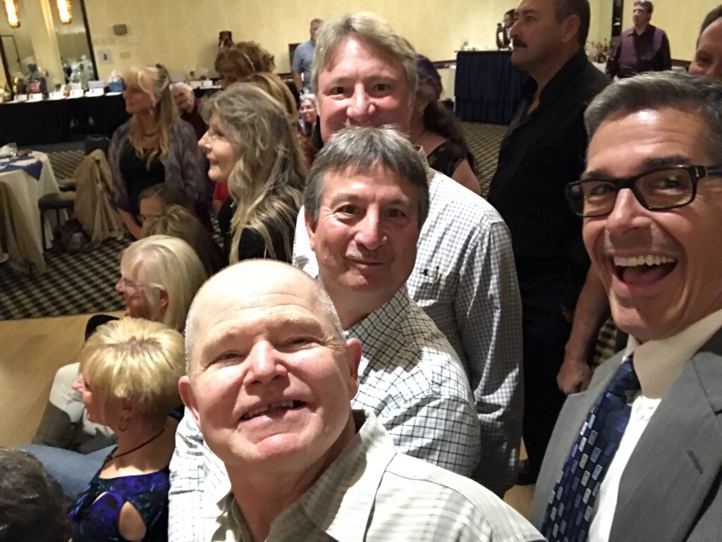 Four men at High School Reunion