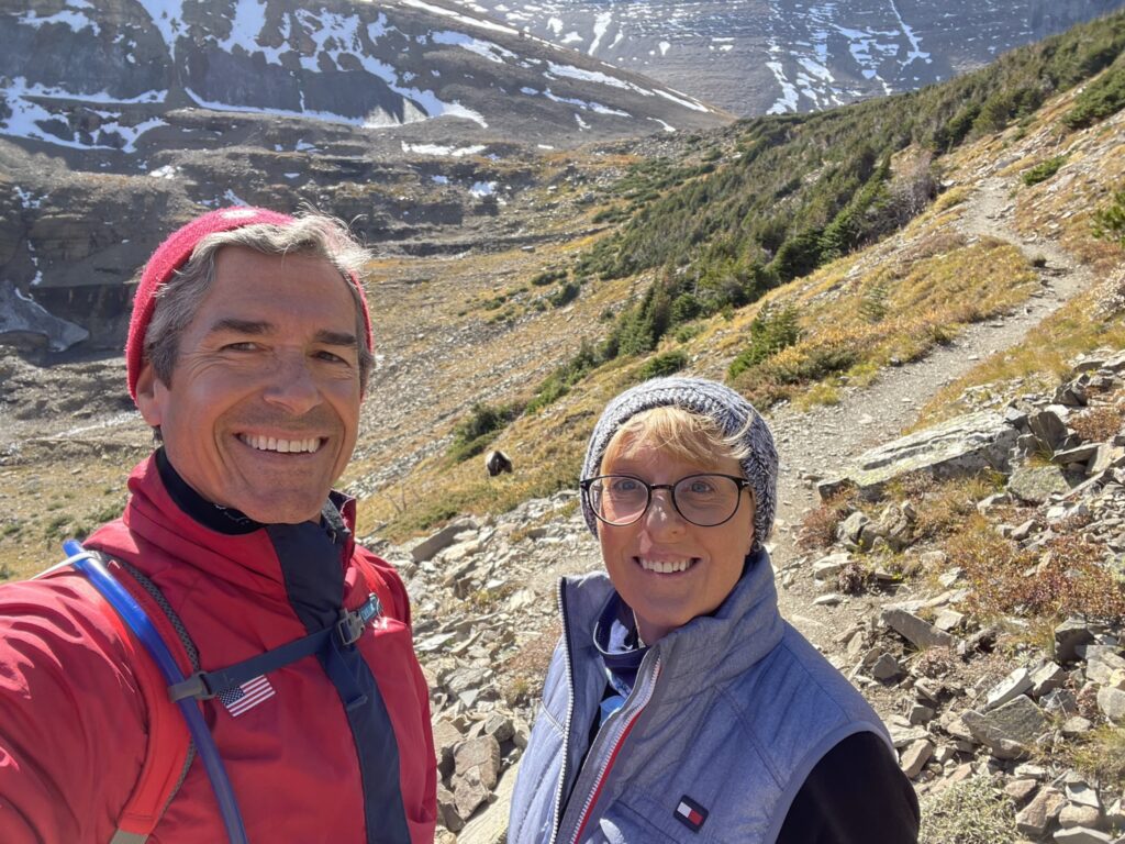 couple in mountains near Grizzly bear