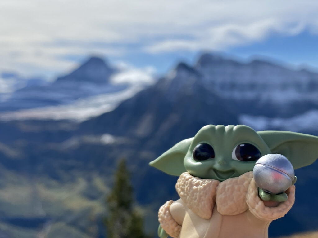 Baby Yoda toy on a mountain