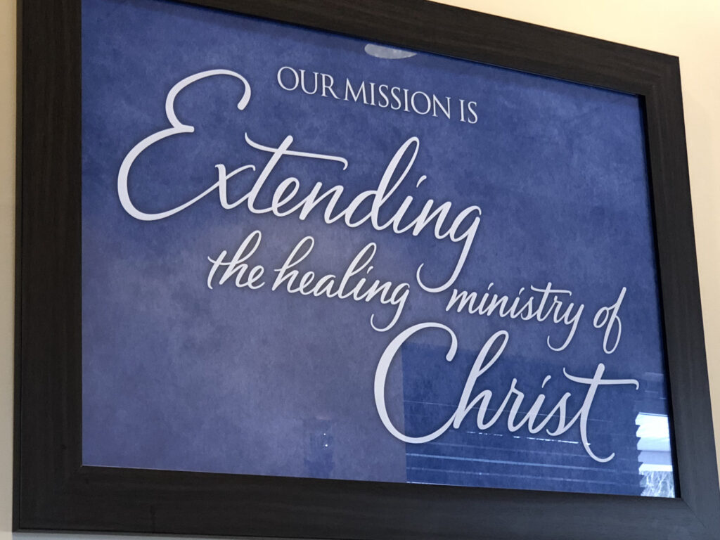 hospital system mission statement framed on the wall