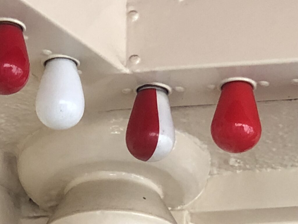 light bulb painted half red and half white