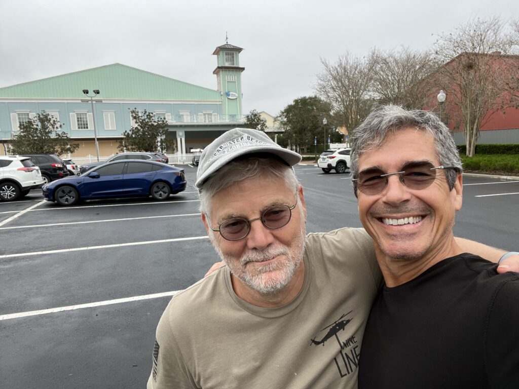 two men in a parking lot at Disney