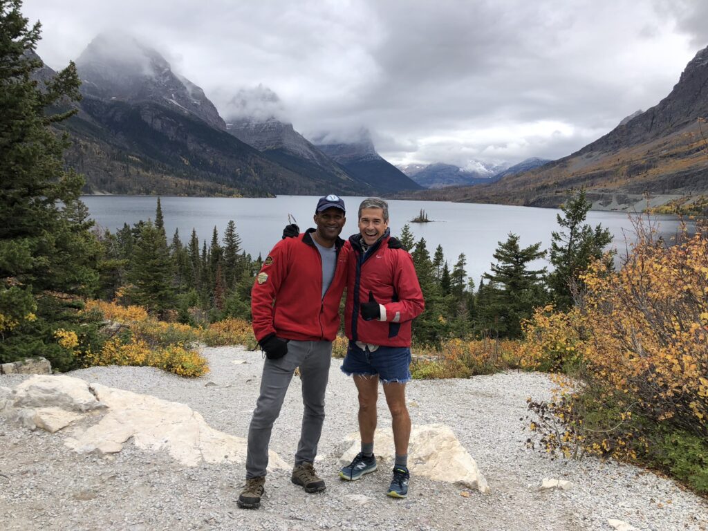 two men at mountain lake