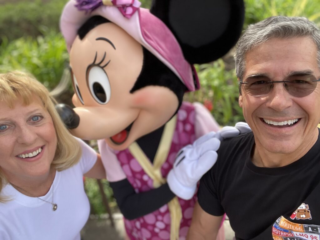 Disney Cast Member couple with Minnie Mouse