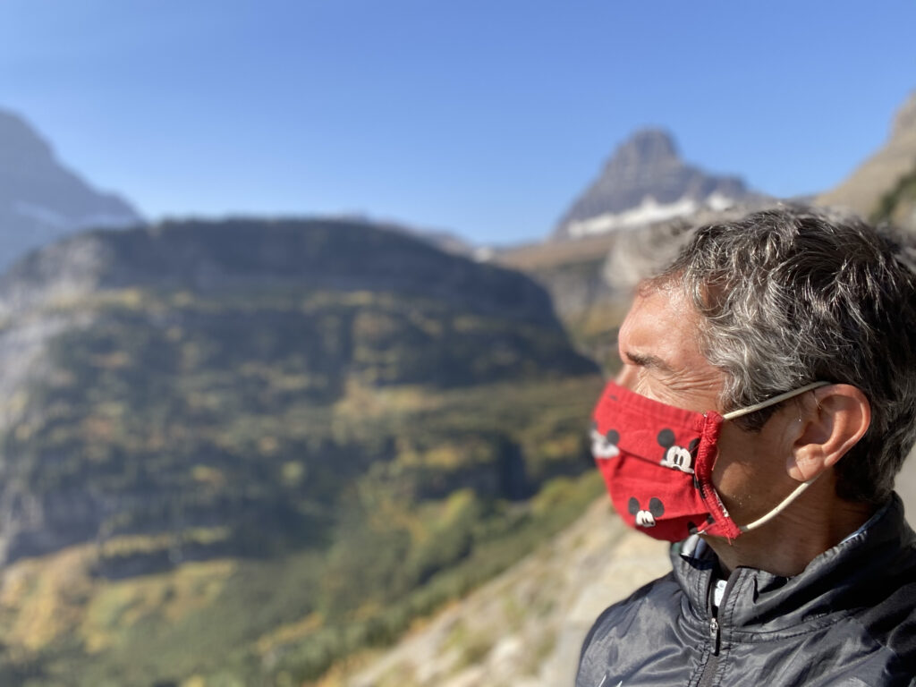 man in the mountains wearing a mask