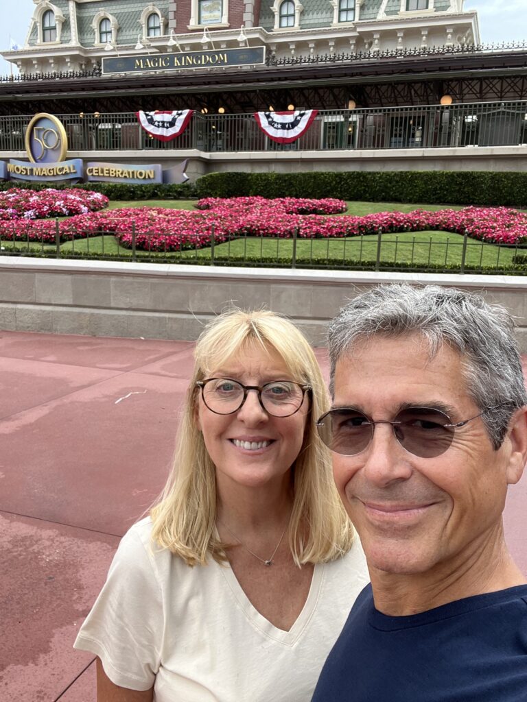 couple at Disney's Magic Kingdom entrance
