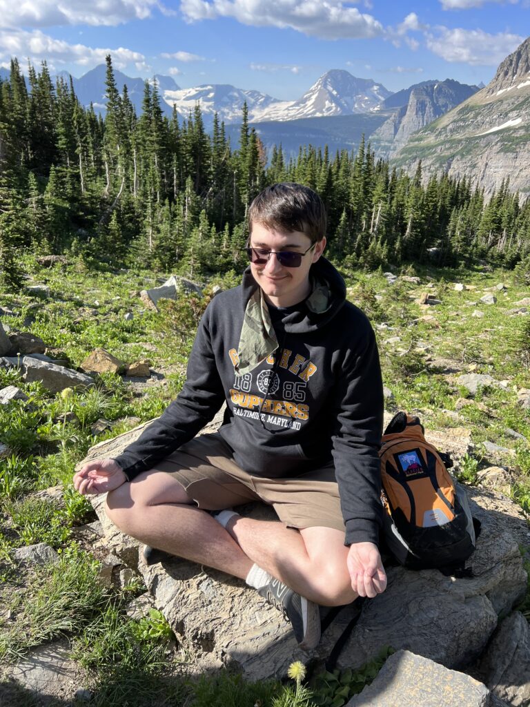 Man meditating in mountains