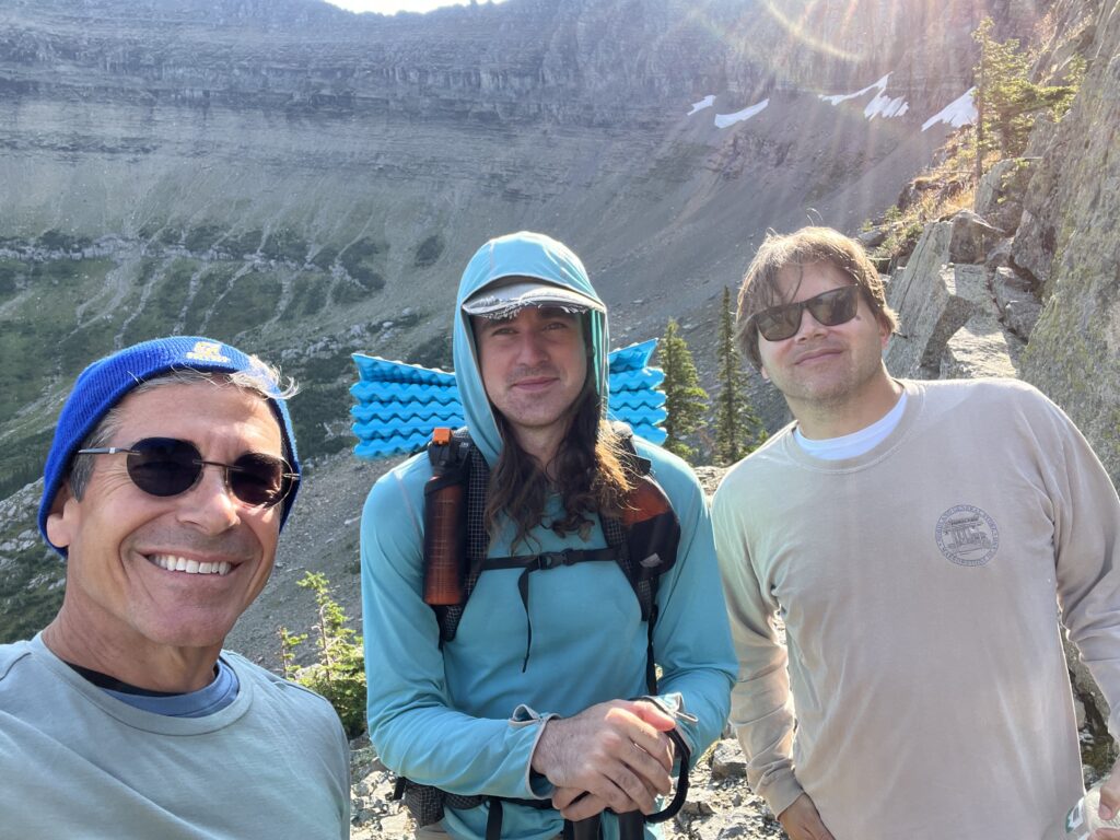 Three men on a hiking trail